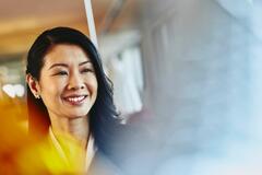 an image of a woman wearing a business suit smiling 