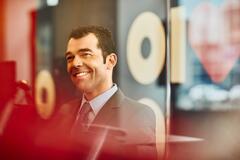 an image of a man wearing a business suit smiling 