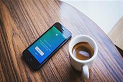 an image of a phone and coffee