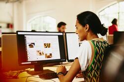 A photo of a woman preparing her digital footprint for work