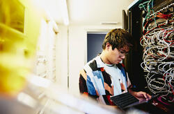 A man working with a device