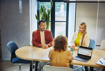 people working in an office boardroom