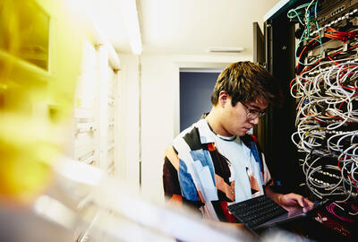 A man working with a device