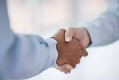 B2B partnership meeting or business people shaking hands for welcome, collaboration or company teamwork. Diversity, networking or handshake for success deal, thank you or corporate support and trust.