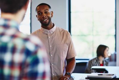 a man talking to a coworker