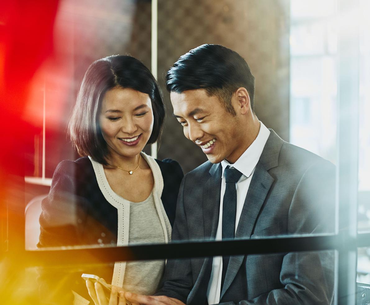 A photo of a man and woman working as system accountants