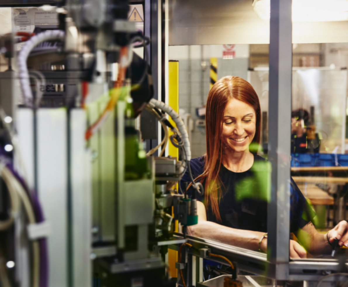 a image of a woman working on a machine