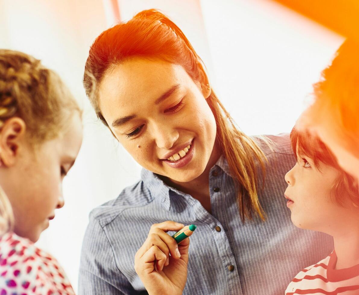 early childhood teacher teacher smiling with children