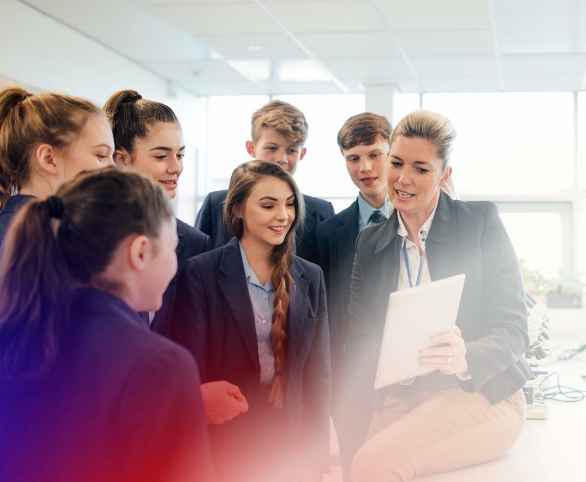 an image of a teacher with a group of students