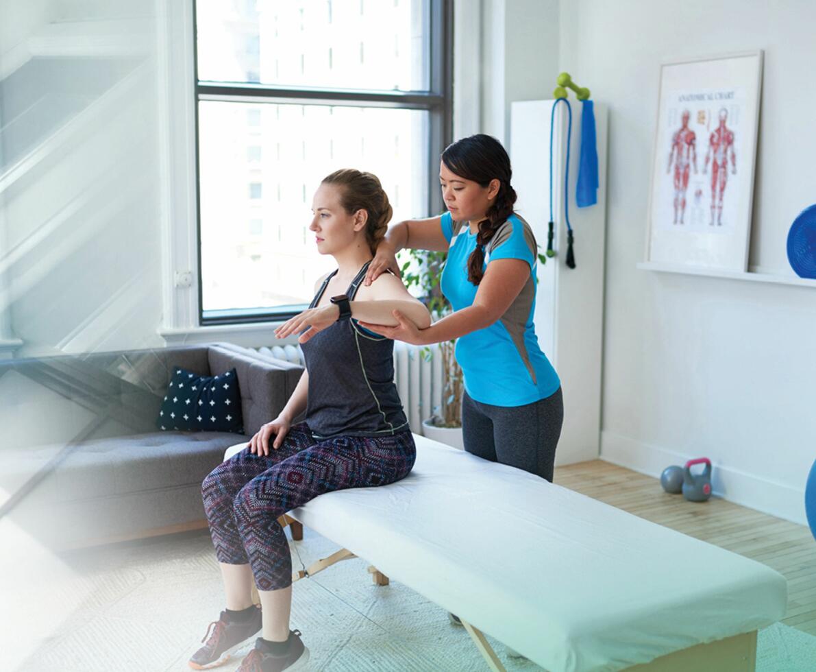 physiotherapist with patient physiotherapist with patient