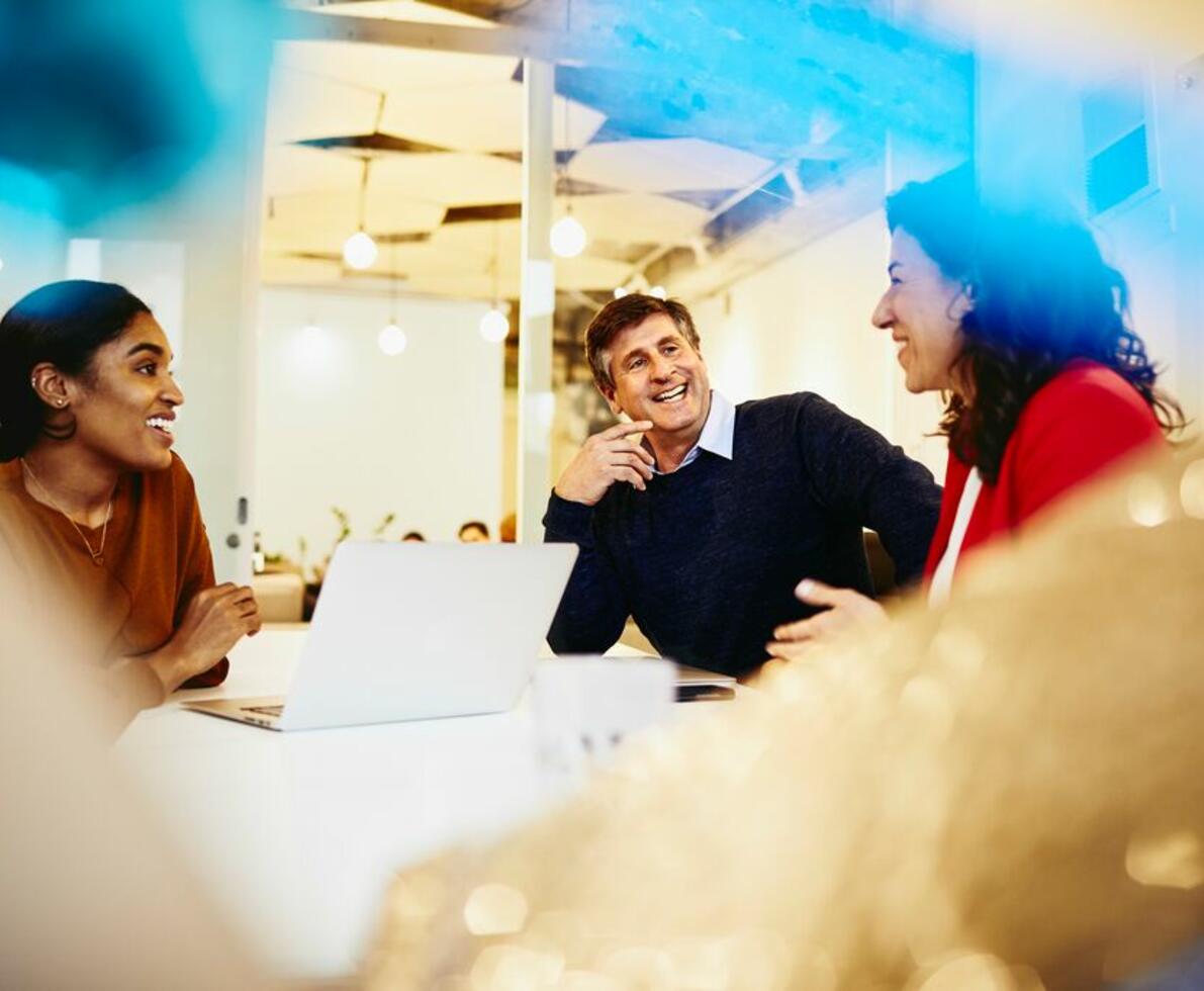 an image of a group conversation in a boardroom