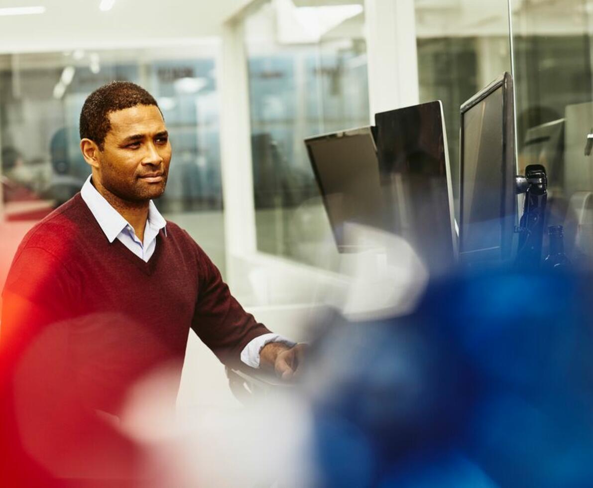 a man looking at something on his monitor 