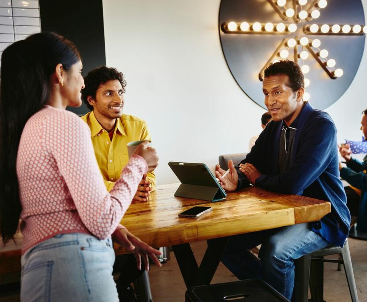 an image of colleagues smiling and chatting