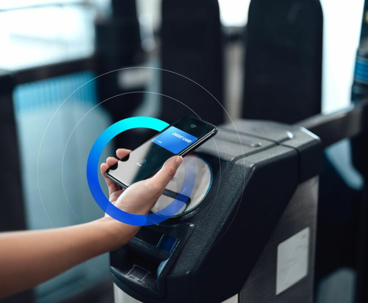 an image of phone being used to scan for payment on an entrance