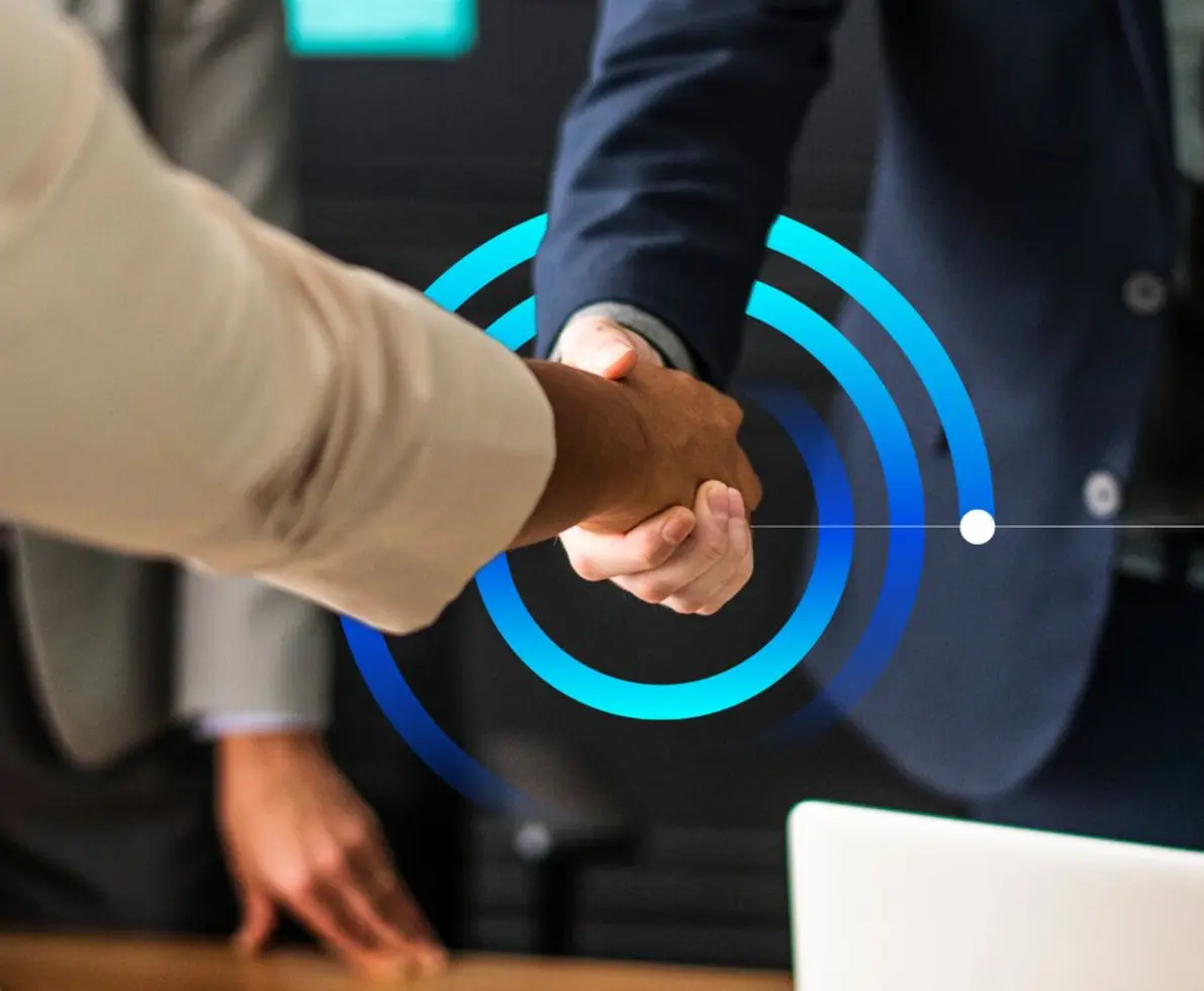 an image of two people shaking hands