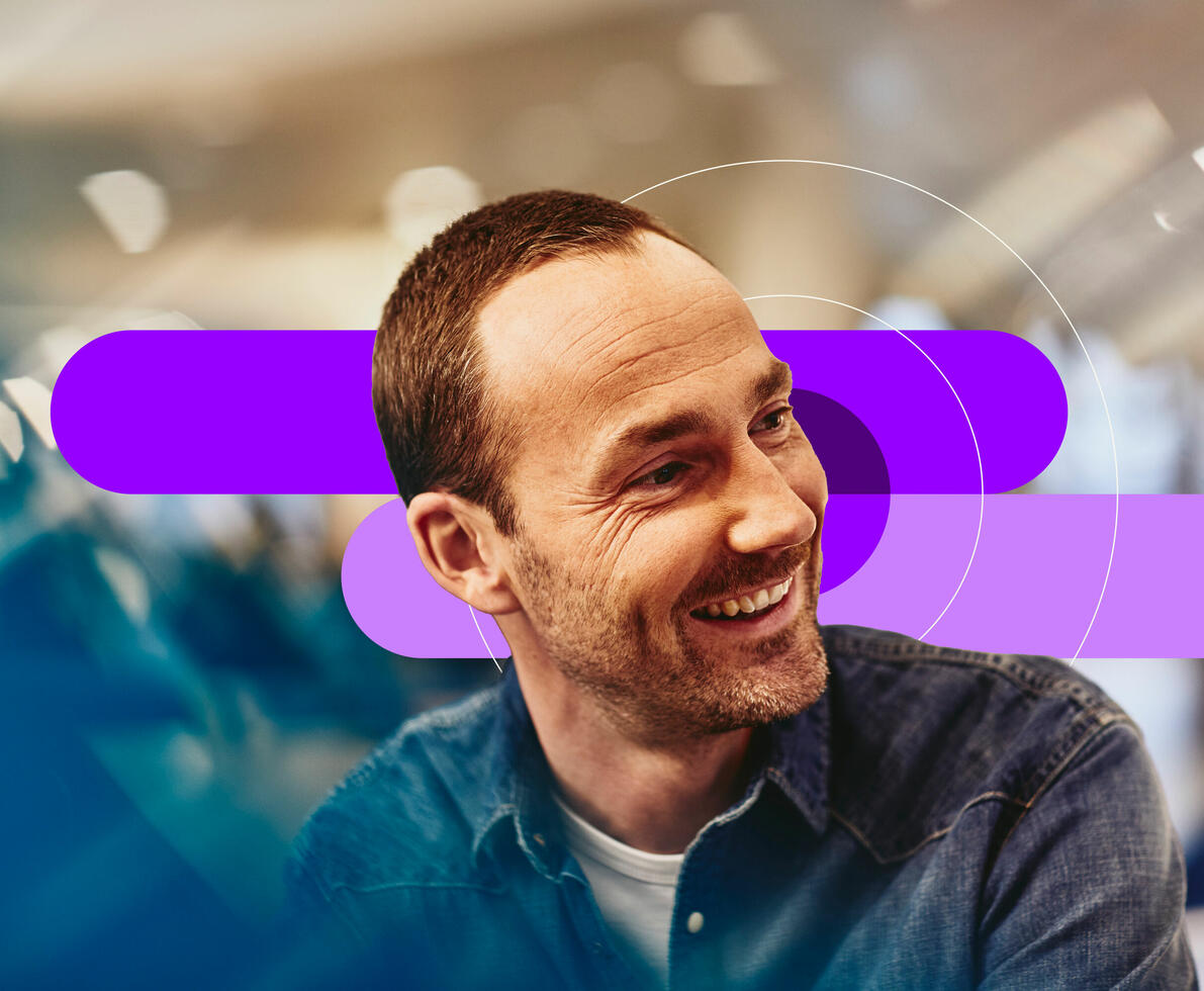 an image of a man smiling and looking to the side