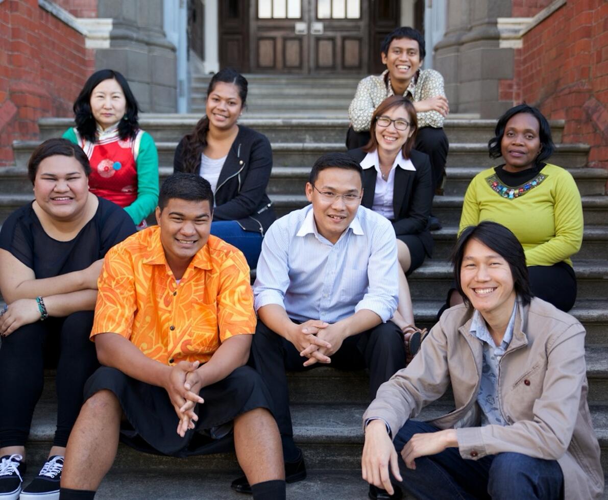 people sitting on the stairs laughing