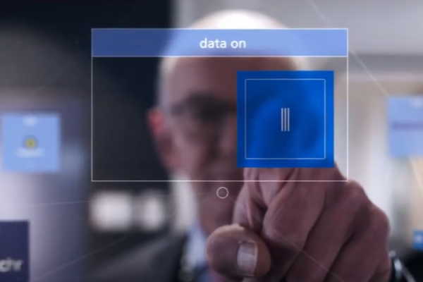 a man pressing on a digital chip in front of the camera