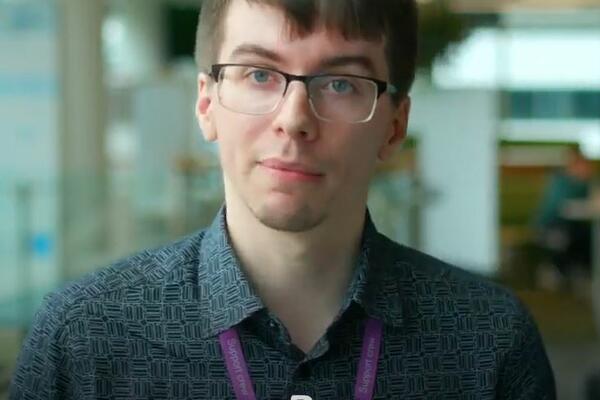 Picture of man smiling. The text shows his name Ben and job title Consultant - Claim Approvals