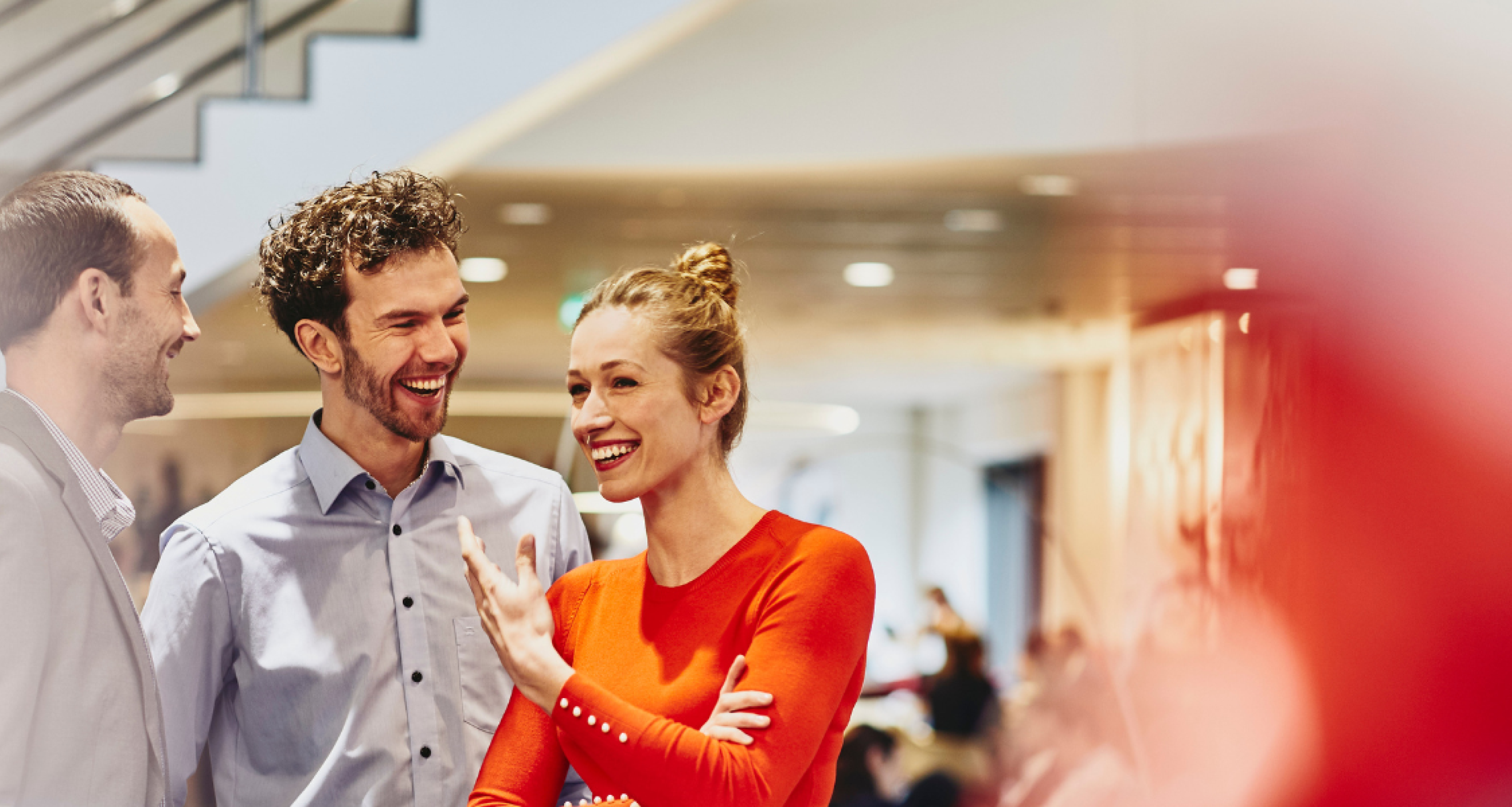 an image of colleagues chatting and laughing