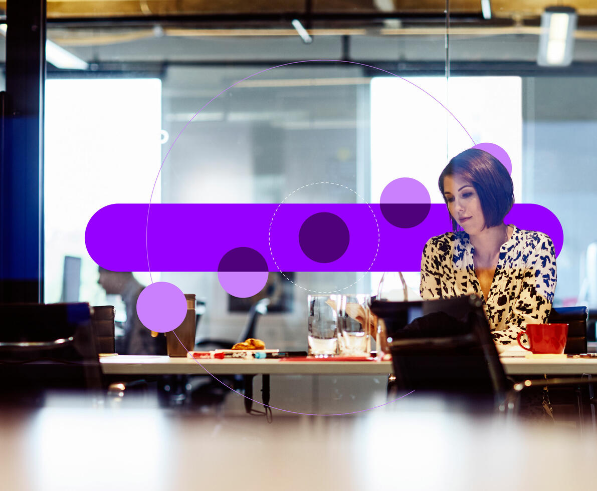 woman working in an office. she's sitting in a meeting room looking at some papers. woman working in an office. she's sitting in a meeting room looking at some papers.